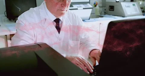 Lab pro typing, starting camera pulling back, adjusting laptop, removing Stock Footage 330741768