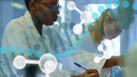 Lab researcher writing notes then reaching for flask and inspecting sample, DNA Stock Footage 333414063