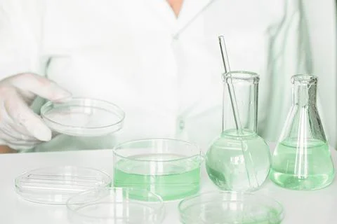 Lab scenario: Aide performs tasks in the laboratory environment. Wearing lab  Fotos de archivo