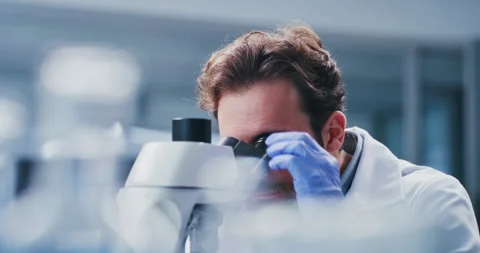 Lab, scientist and man with microscope, medicine and cell analysis for vaccine Stock Footage 330038892
