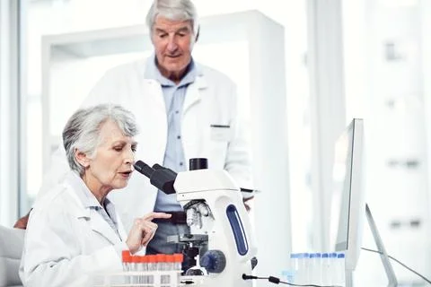 Lab, scientist and people with microscope, teamwork and medical research fo.. Stock Photos