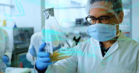 Lab scientist picking flask activating cyan overlay switching flasks comparing Stock Footage 310427754