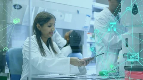 Lab scientist sorting papers lifting tablet and tapping screen visualizing data Stock Footage 317369271
