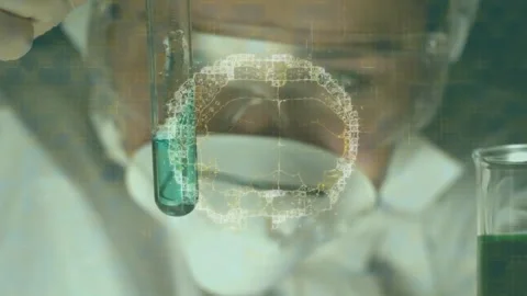 Lab scientist tilting test tube and analyzing teal solution, causing holo brain Stock Footage 330355462
