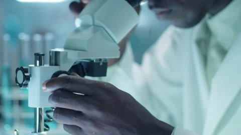 Lab Scientist Working with Compound Microscope Stock Footage 234559925