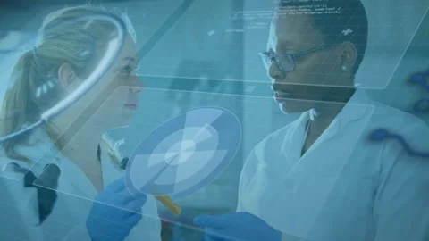 Lab scientists picking test tube and analyzing holographic data rotating wafer Stock Footage 311141150
