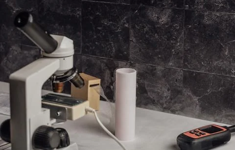 Lab setup dedicated to the study of animal reproduction, featuring a microscope Stock Photos