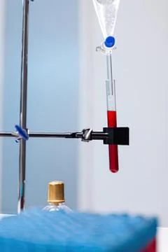 Lab setup with test tube and liquid drops Stock Photos