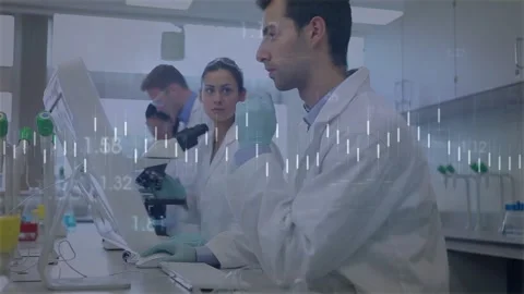 Lab team alternating typing adjusting scope, pointing sparking data review with Stock Footage 329533767