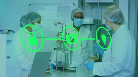 Lab team demoing reactor, right tech lifting flask activating lock-gear-bulb Stock Footage 328307012
