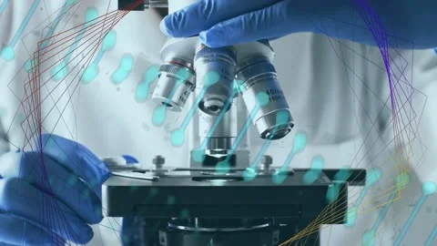 Lab tech holding slide turning turret lowering 40x focusing sample for analysis Stock Footage 334744013