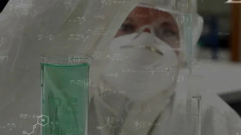 Lab tech lowering pipette, dispensing into beaker for accuracy, formulas Stock Footage 328446601