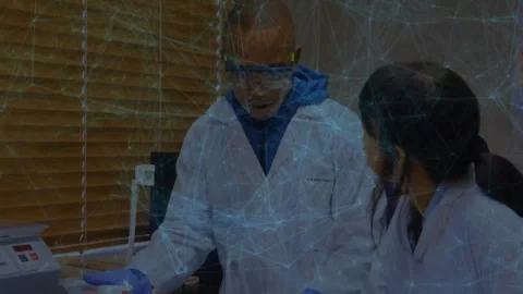 Lab tech man teaching trainee by adjusting pipette at bench, animated labels Stock Footage 331634562