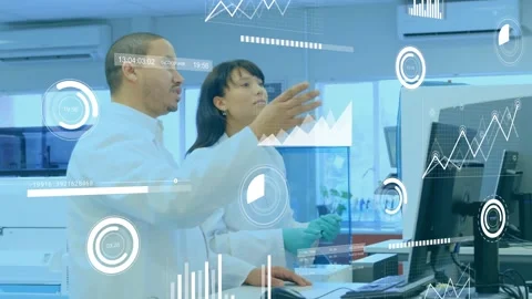 Lab tech moving mouse reviewing data, colleague entering and analyzing animated Stock Footage 320066932