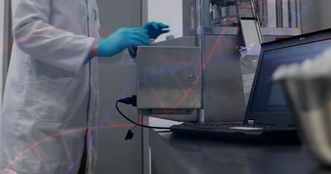 Lab tech placing gloved hands on instrument calibrating device, logging data on Stock Footage 334115213