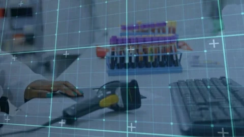 Lab tech placing hand on mouse, camera shifting revealing scanner,tubes cyan Stock Footage 330602268
