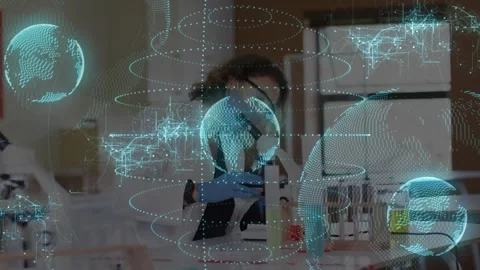 Lab tech placing slide peering microscope analyzing sample as AR globes partly Vidéo 330238419