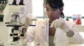 lab tech pouring liquid in test tube HD Footage