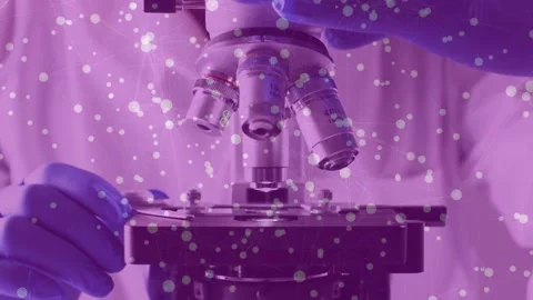 Lab tech reaching gloved hand, rotating turret aligning 40x objective, focusing, Stock Footage 333999110