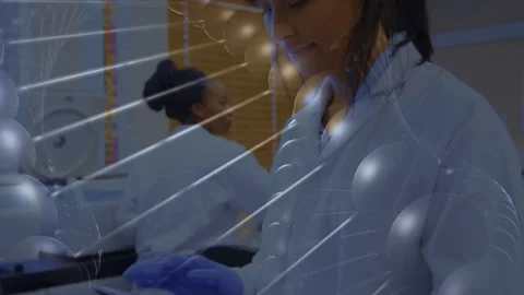 Lab tech tapping tablet, activating radial overlay while checking data, Stock Footage 335761909
