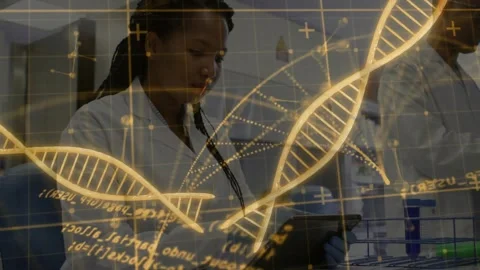 Lab tech tapping tablet causing DNA overlay crossing front and behind, handling Stock Footage 330509233