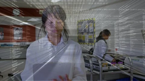 Lab tech tapping tablet, data overlay appearing guiding sample processing while Stock Footage 333414318