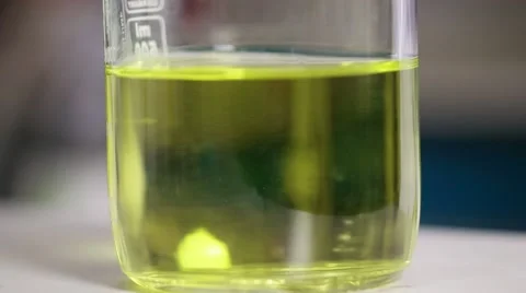 Lab technician analysis xylanase enzyme, close up detail of yellow liquid Stock Footage 68148700