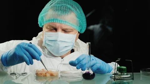 The lab technician checks the quality of the chicken meat in the lab. Food Stock Footage 125554145
