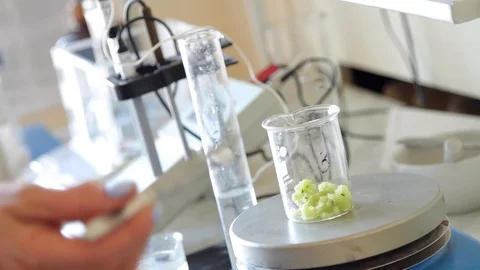 Lab technician doing an experiment in a laboratory. Stock Footage 127321659