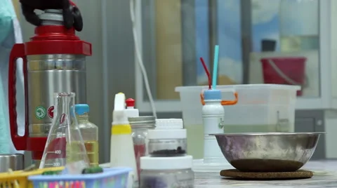 A lab technician doing experiments in the chemistry lab Stock Footage 64455181