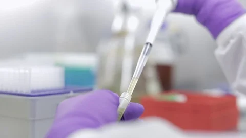 Lab Technician Extracting Solution with an Autoclavable Pipette Stock Footage 71455329