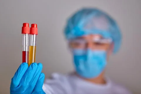 Lab technician holding blood sample test tubes Stock Photos