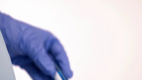 Lab technician holds samples Covid-19 analysis. Coronavirus nasal swab tests Stock Footage 128915420