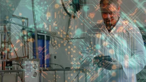 Lab technician in lab coat tapping tablet and revealing animated circuit data Video stock 330462607
