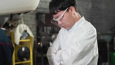 Lab Technician Observing Work in Automobile Workshop Stock Footage 303065877