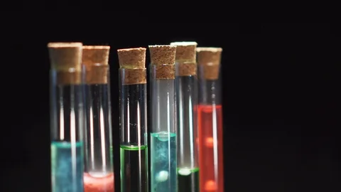 Lab technician opens a test tube with boiling liquid, close-up of a hand. Video stock 122014565