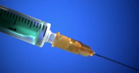Lab Technician Preparing Vaccine With Sterile Equipment Under Dramatic Lighting Stock Footage 335848395