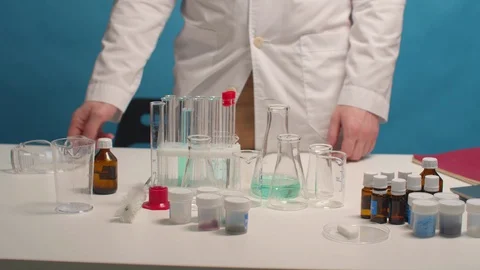 Lab technician puts on safety glasses before work Stock Footage 129976161