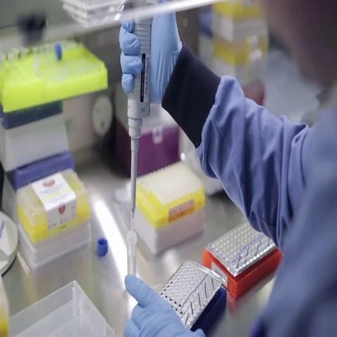 Lab Technician Transferring Solution with an Autoclavable Pipette Stock Footage 69285805