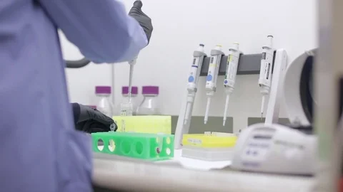Lab Technician Transferring Solution with an Autoclavable Pipette Stock Footage 71455085