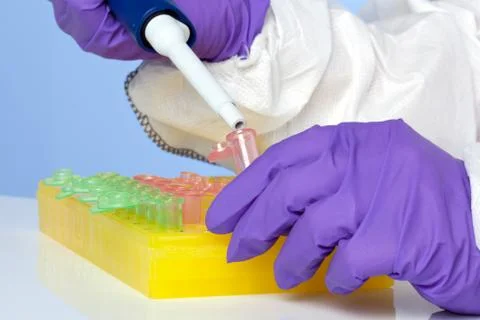 Lab technician using a pipette Stock Photos