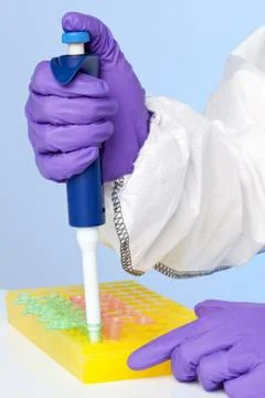Lab technician using a pipette Stock Photos