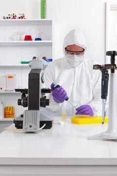 Lab technician using a pipette Stock Photos