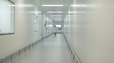 Lab Technician Walking Down Corridor Stock Footage 68642371