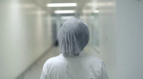 Lab Technician Walking Down Corridor Stock Footage 68642511