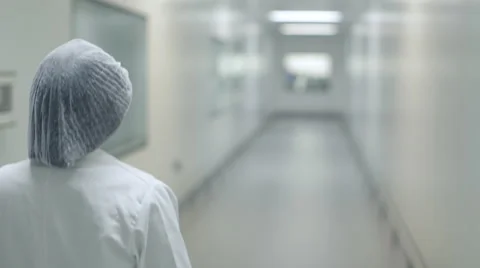 Lab Technician Walking Down Corridor Stock Footage 68642677