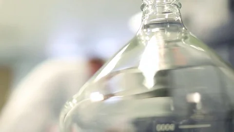 Lab Technician Working Behind Glass Beaker Stock Footage 69087632