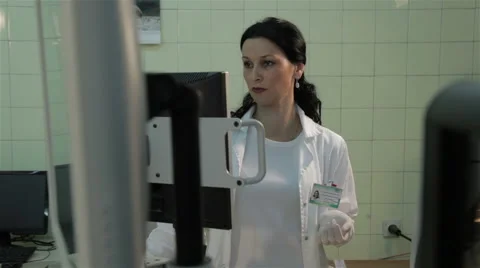 Lab technician working on device for sample analysis, tracking shot. pan left. Stock Footage 52264864