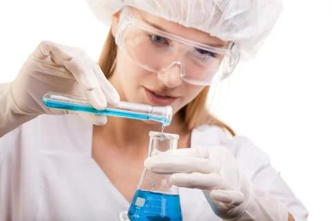 Lab Technician working with Test Tube and Flask Stock Photos