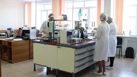 Lab technicians in the lab do their job. The video was shot in a General plan. Stock Footage 128374549
